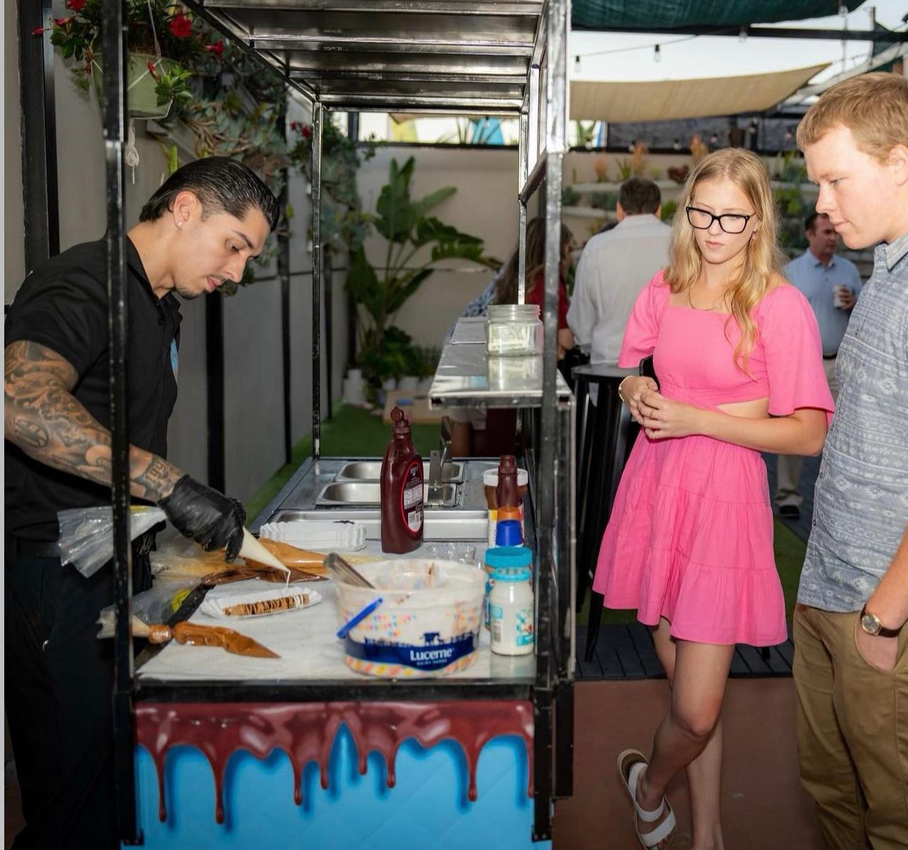 Preparing churros for guests