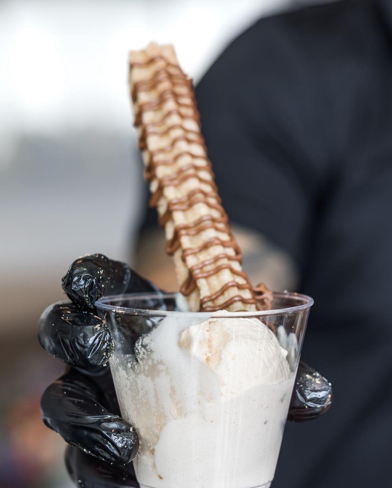Churros with toppings displayed at event