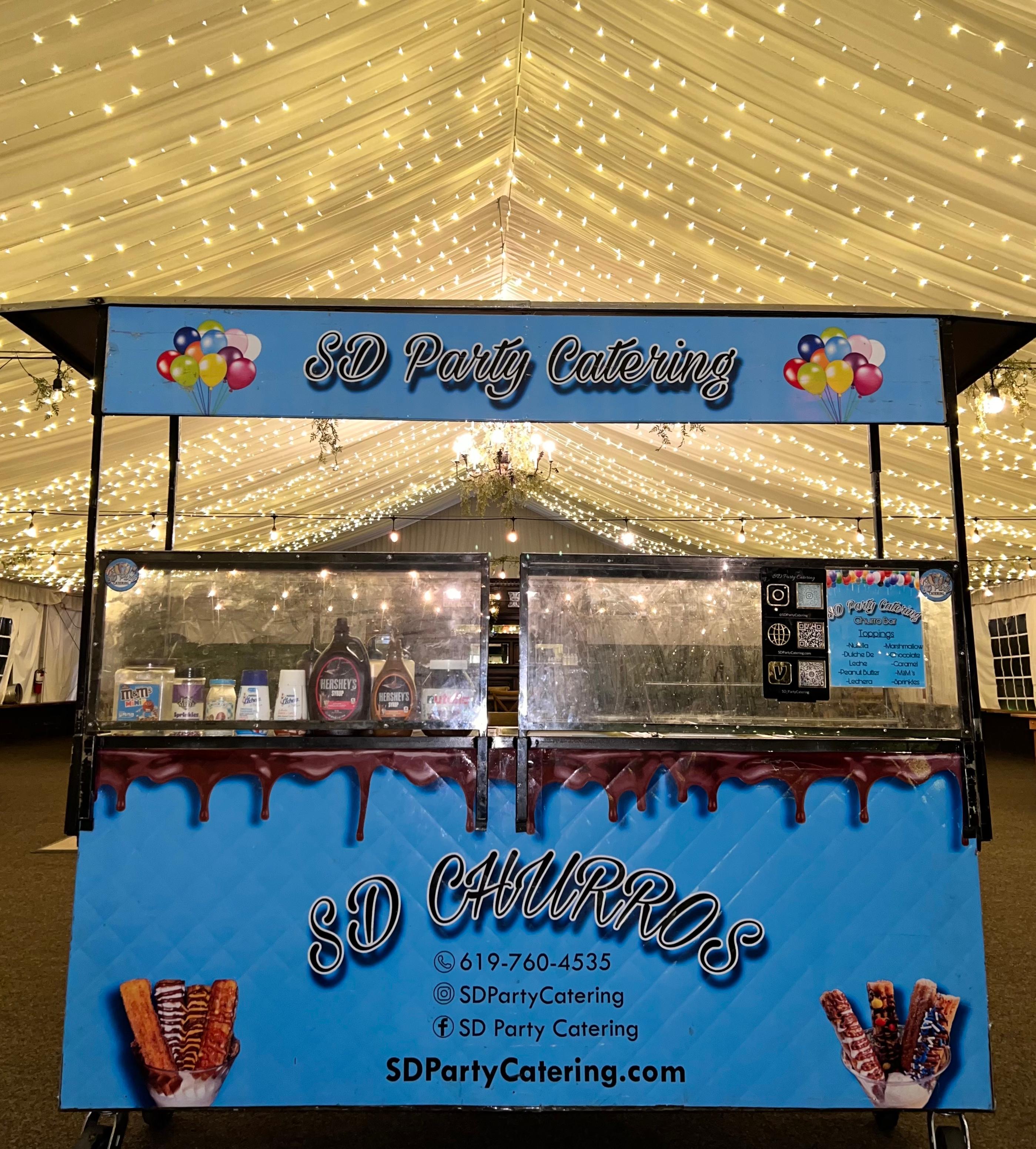 Churro cart with toppings display